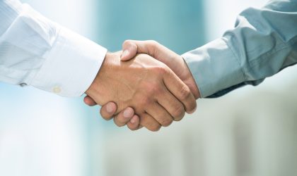 Close-up image of a firm handshake standing for a trusted partnership