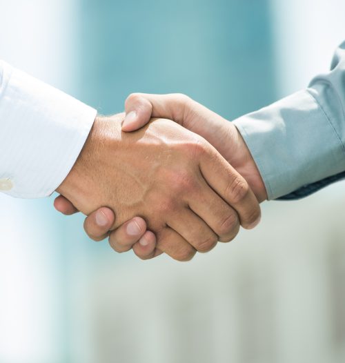 Close-up image of a firm handshake standing for a trusted partnership
